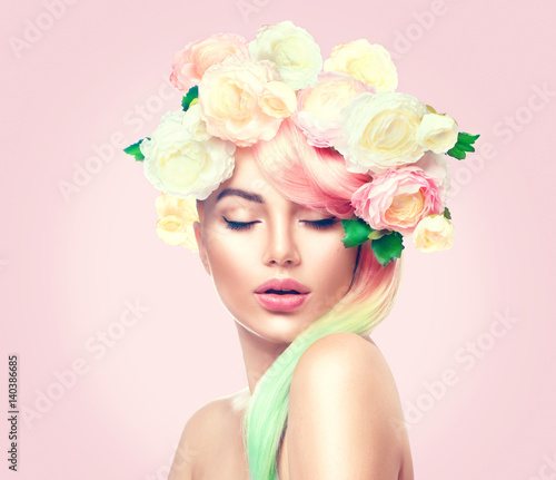 Beauty summer model girl with colorful flowers wreath. Flowers hair style