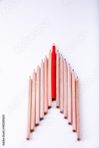 the wooden pencil arrange as head of arrow with one different as a symbol of difference concept