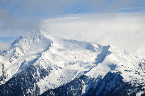 Mountain piek with clouds and snow