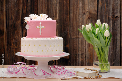 first holy communion cake on wooden background