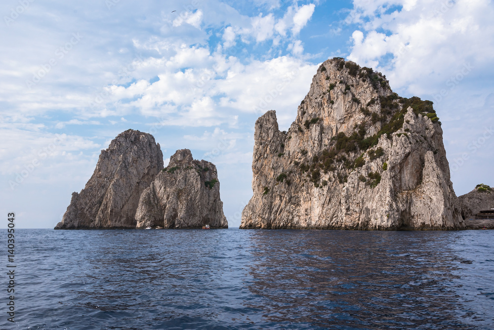 Cliff coast of Capri Island with famous Faragioni rocks