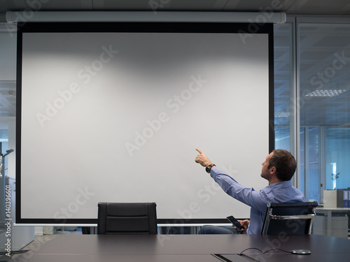Manager explains at projection screen