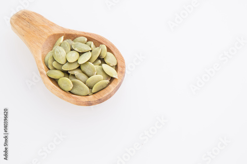 Pumpkin seeds on white background