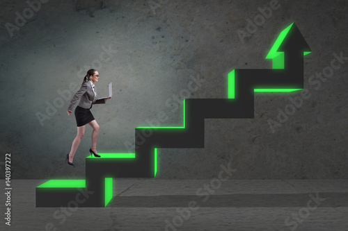 Young businesswoman climbing career ladder