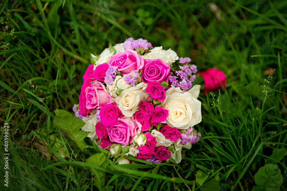 Beautiful bridal bouquet tied with silk ribbons. Wedding Accessories Beautiful bridal bouquet tied with silk ribbons. Wedding Accessories