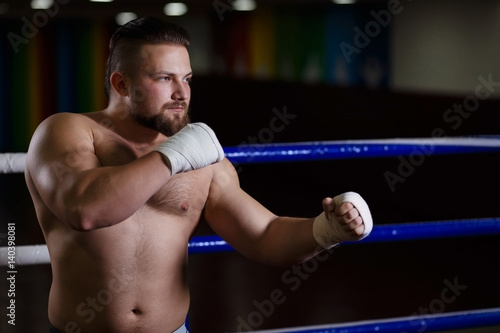 Strong man fighter standing in the boxing ring © Vadym