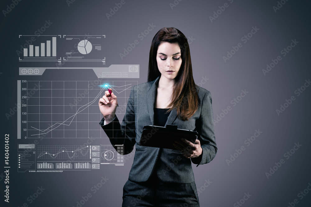 Portrait d'une jeune femme d'affaires au travail, une tablette tactile dans ses mains Portrait d'une jeune femme d'affaires au travail, une tablette tactile dans ses mains