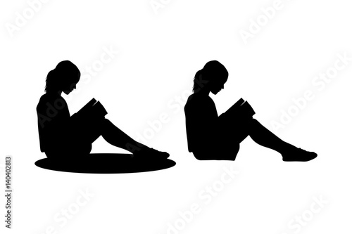 child sitting reading silhouette