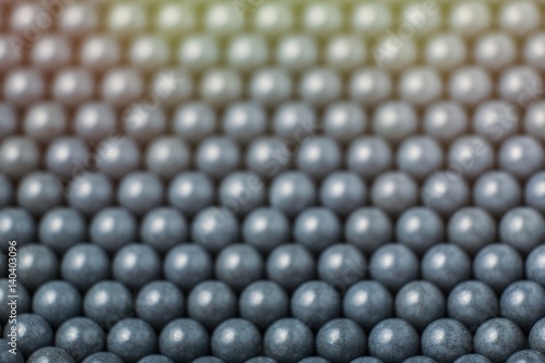blurred background of grey airsoft balls of 6mm