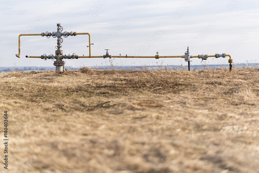 Gas pipeline in the middle of the field. Extraction of gas from storage. Gas pipeline in the middle of the field. Extraction of gas from storage.