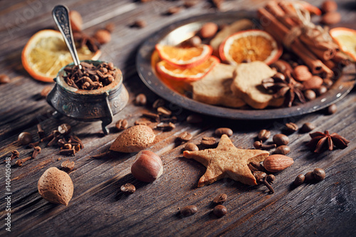 Homemade gingerbread cookies, spices and decorations