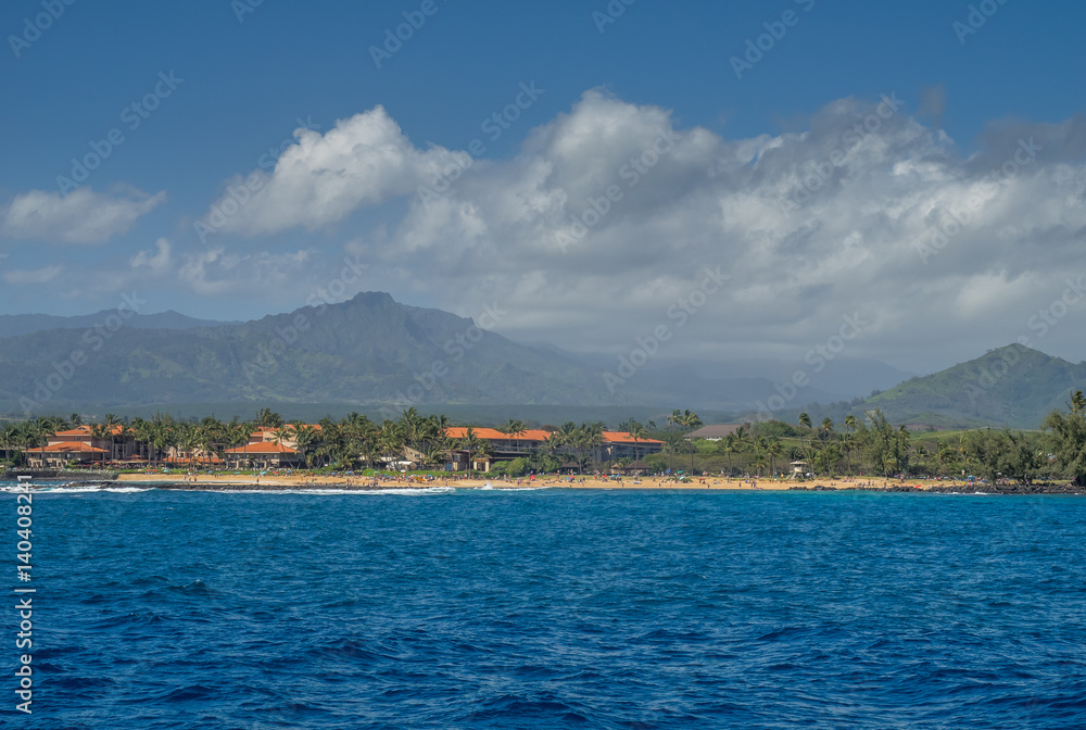 View of famous Poipu beach on Kauai from the ocean. 