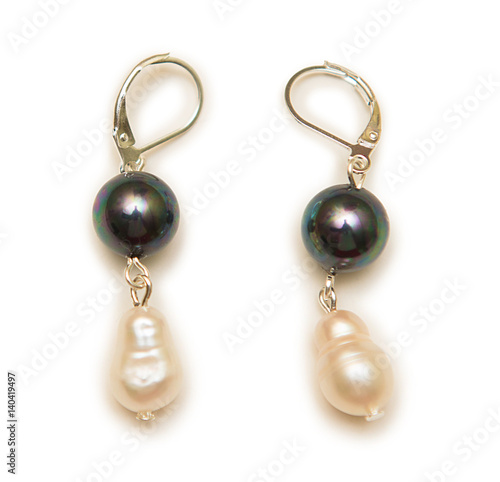 Elegant earrings isolated on white background