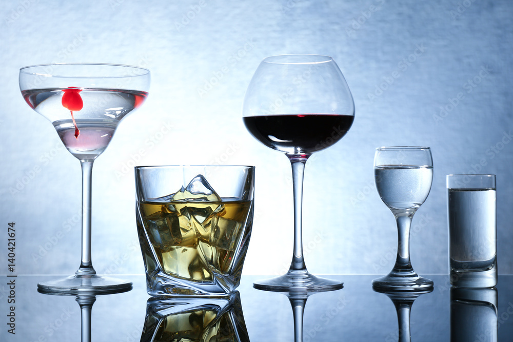 Different glasses of wine and spirits on color background Different glasses of wine and spirits on color background