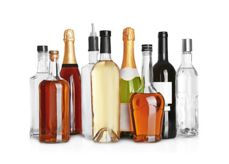 Different bottles of wine and spirits on white background