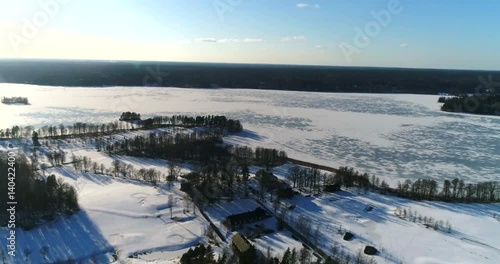 Bodom mansion, Cinema 4k aerial flight above a golf course,and heading towards Bodom mansion, on a sunny and snowy winter day, in Espoo, Finland photo