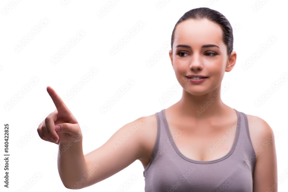 Young sports girl pressing virtual button isolated on white Young sports girl pressing virtual button isolated on white