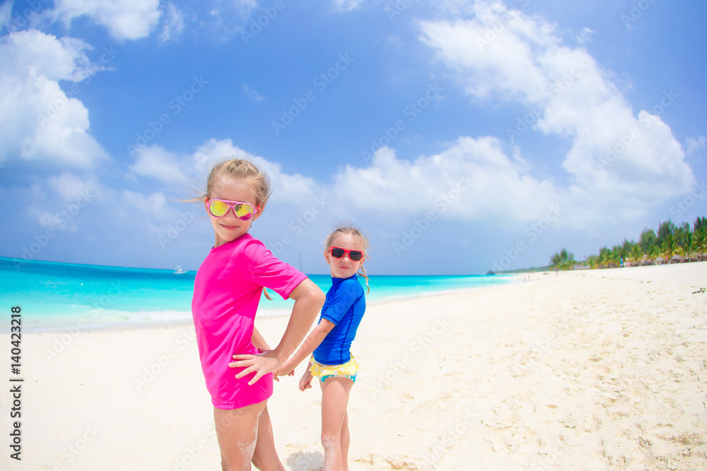 Girls having fun at tropical beach during summer vacation Girls having fun at tropical beach during summer vacation