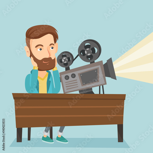 Caucasian projectionist showing new film.