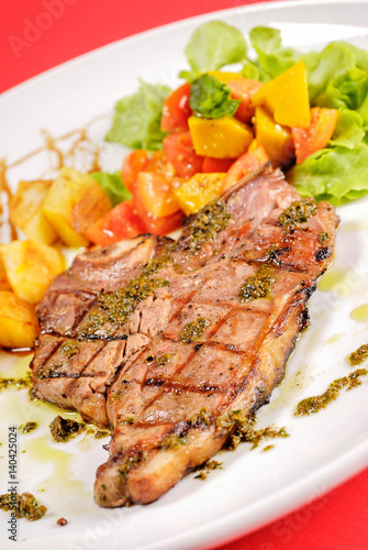 Pork chop steak with chilii sauce at the restaurant