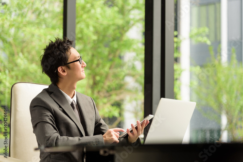 Smart businessman thinking and look forward to create new project photo