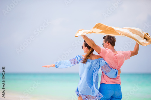 Young happy couple during tropical beach vacation