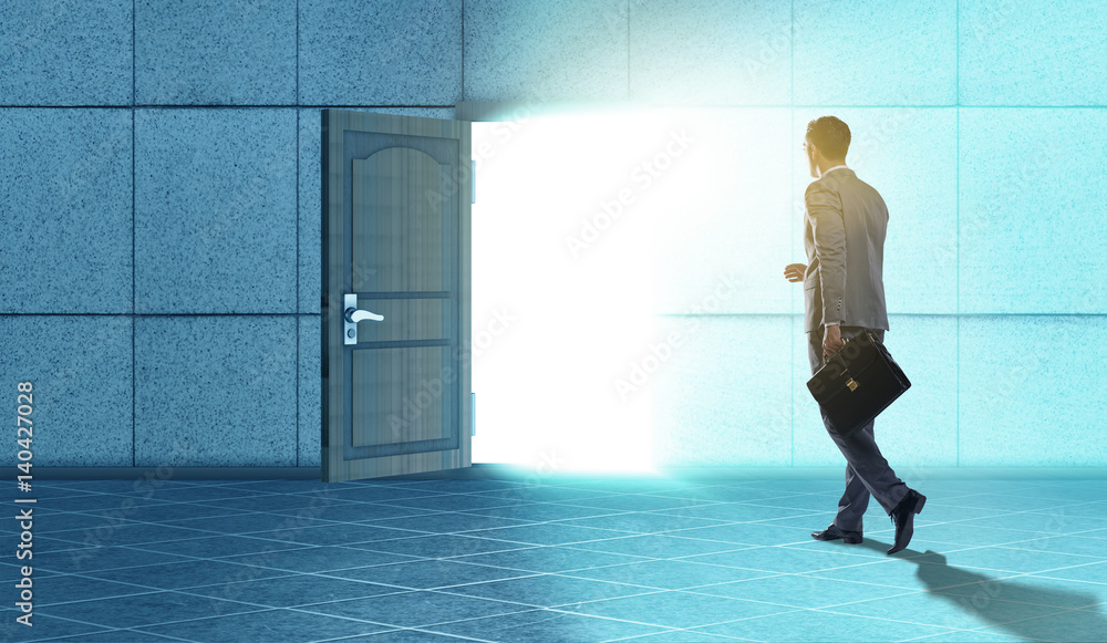 Fototapeta premium Businessman walking towards open door