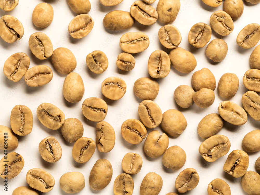 top view of white coffee beans on white background top view of white coffee beans on white background