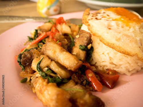 Traditional Thai dish crispy pork with a fried egg