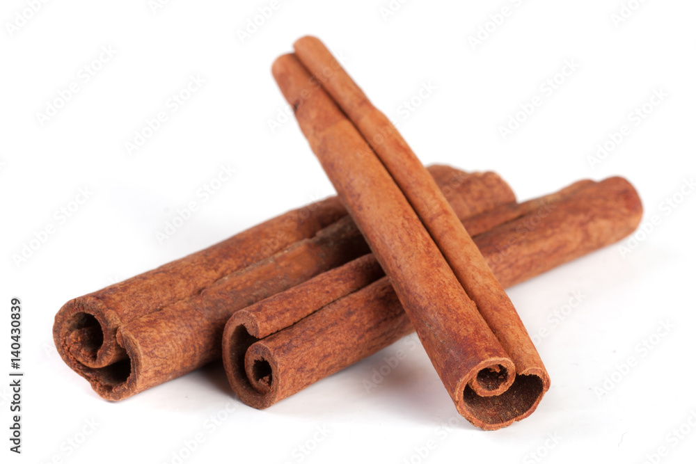 three cinnamon sticks isolated on white background three cinnamon sticks isolated on white background