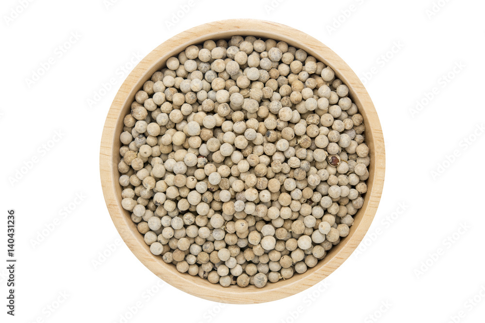 White peppercorns in wooden bowl isolated top view on white White peppercorns in wooden bowl isolated top view on white