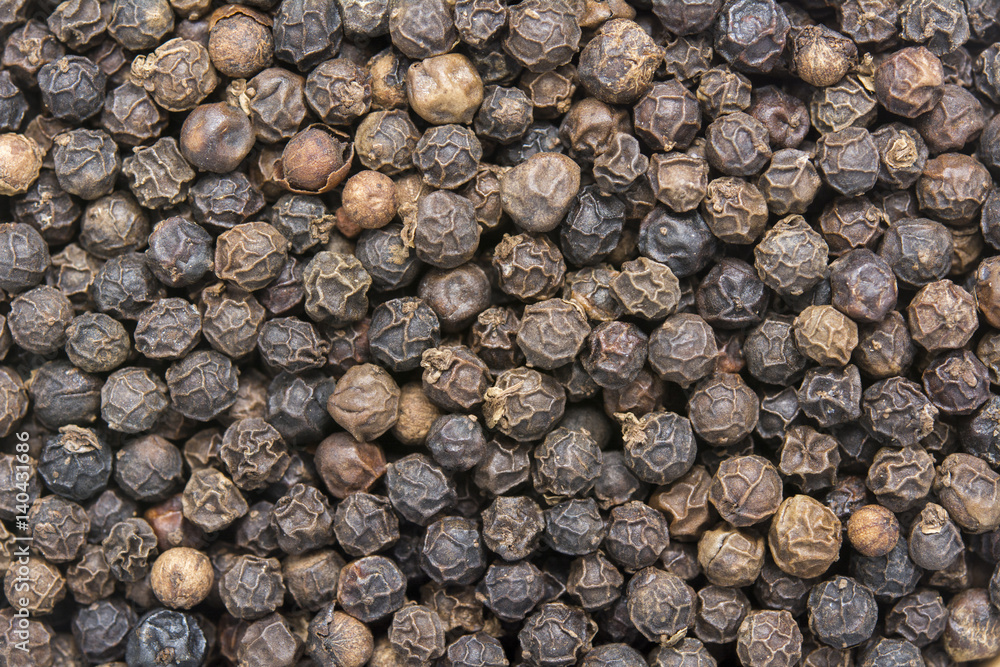Black peppercorns background Black peppercorns background