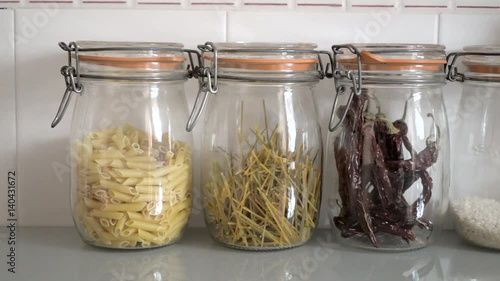 jars filled with pasta and rice photo