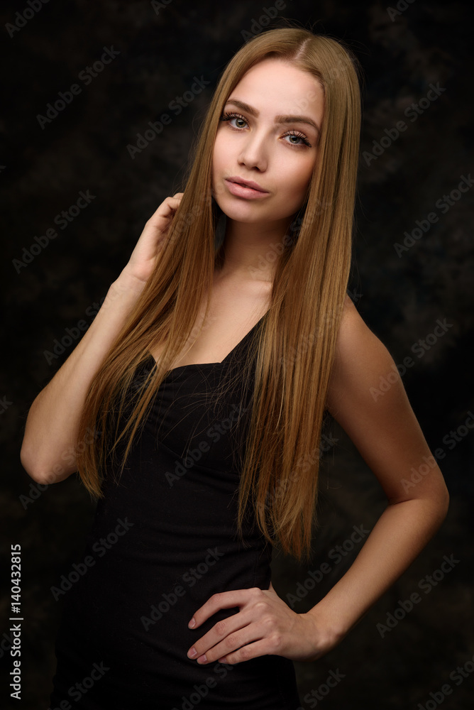 Fototapeta premium Beauty portrait of a young woman with long hair