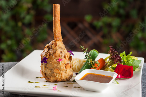 lamb shank with vegetable and gravy photo