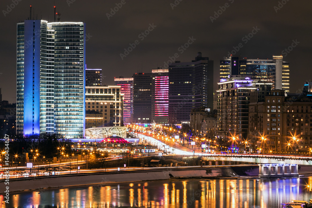 Night streets of Moscow in the spring. View of the building of Novy Arbat Street and the building of the Moscow City Hall Night streets of Moscow in the spring. View of the building of Novy Arbat Street and the building of the Moscow City Hall