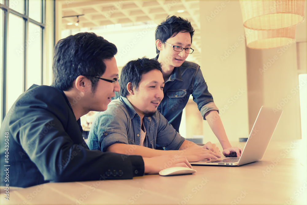 Group of Asian Business man in casual suit meeting and looking presentation project on thier laptop in the modern office or coffee shop, Project and Business concept Group of Asian Business man in casual suit meeting and looking presentation project on thier laptop in the modern office or coffee shop, Project and Business concept