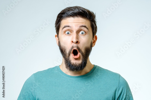 Man with shocked, amazed expression photo