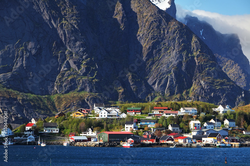 Norwegian fishing village with traditional red rorbu huts, Reine, Lofoten Islands, Norway photo