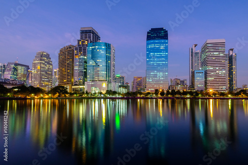 City downtown at night with reflection of skyline.