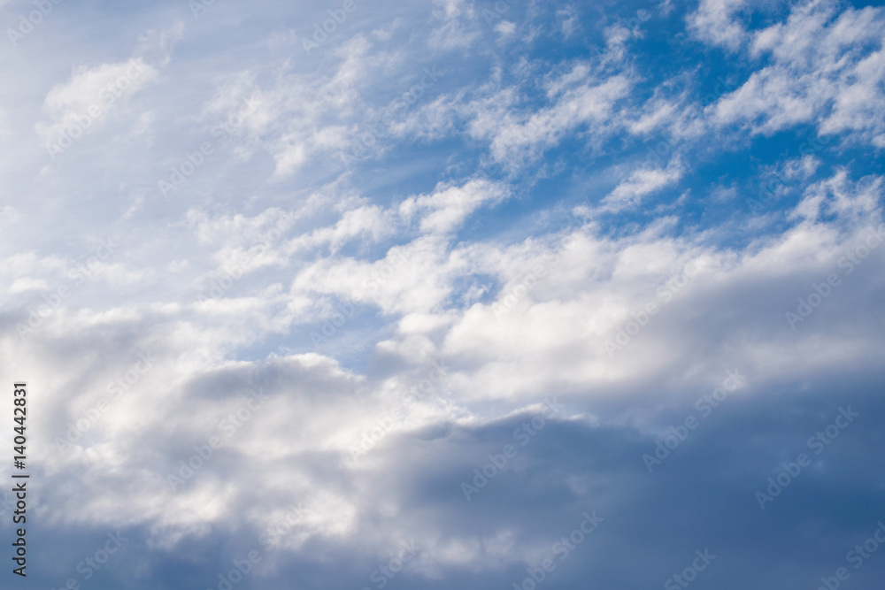 The backdrop of blue winter sky with dark clouds at sunrise in the early morning