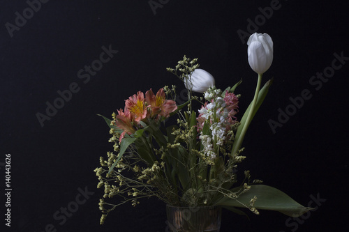Bouquet with tulips on a dark background