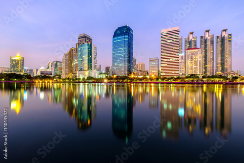 City downtown at night with reflection of skyline. © panya7