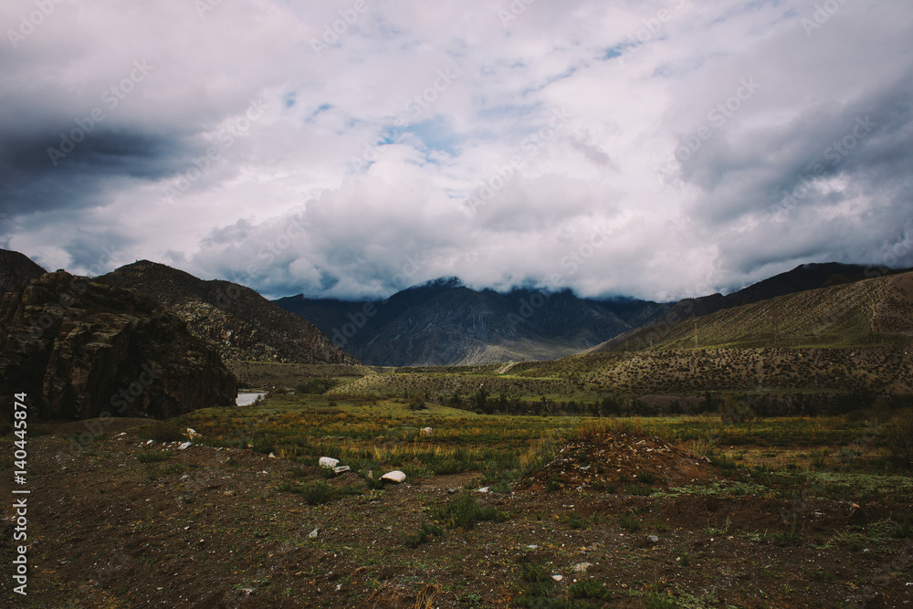 Fototapeta premium Mountains in the fog in cloudy weather