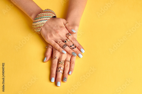 Beautiful well-groomed female hands with nail polish.
