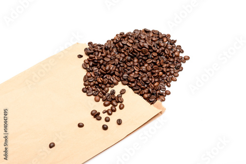Coffee beans in crafted paper pack isolated on white background