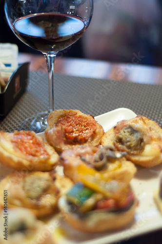 Traditional cicchetti with red Wine in a Venetian bar