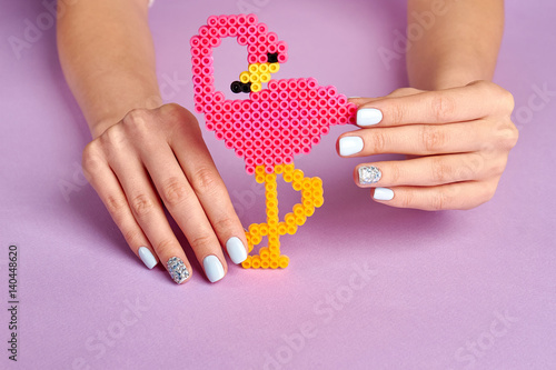 Wallpaper Mural Bright toy pink flamingo. Beautiful manicure. Torontodigital.ca