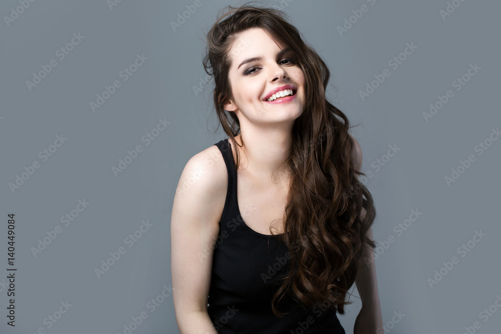 Smiling Woman on a gray background. Smiling Woman on a gray background.