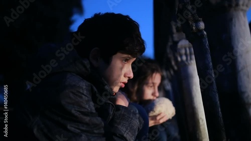 Children refugees against the backdrop of bombed houses. war